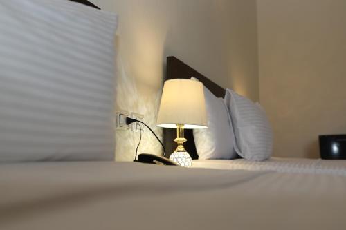Cama o camas de una habitación en New Midtown