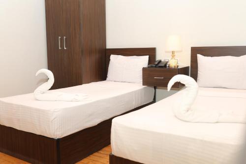 Cama o camas de una habitación en New Midtown