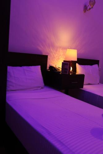 Cama o camas de una habitación en New Midtown