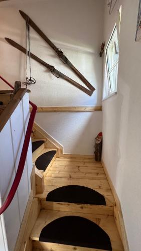 a set of stairs in a room with some tools at Haus Helli in Berwang