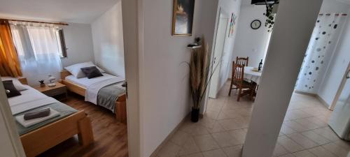Postel nebo postele na pokoji v ubytování Apartments Ćosic