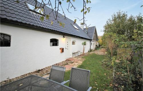a view of a house with a table and chairs at Gorgeous Home In Rydebäck With Wifi in Rydebäck