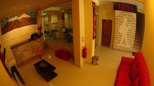 an overhead view of a living room with a red couch at Hotel REY DAVID in Uyuni