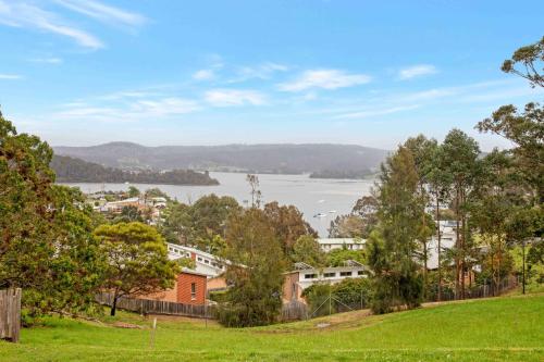 a view of the water from a park at The Tree Motel in Narooma