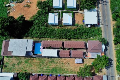an overhead view of a row of houses with roofs at Virawan pool kohlarn in Ko Larn