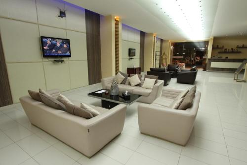 a large living room with couches and a tv at Raoum Inn Khafji Southern in Khafji