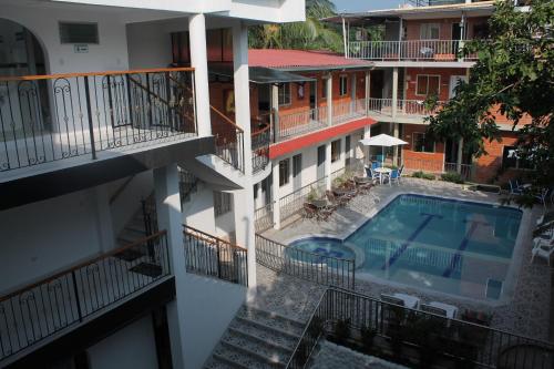 an aerial view of a building with a swimming pool at Victoria Imperial Hotel in Mariquita