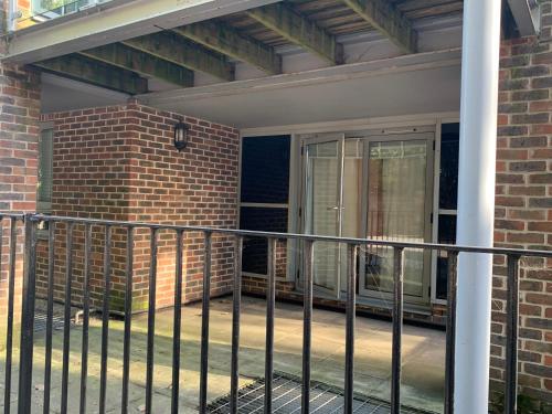 a balcony with a fence in front of a brick building at Centra St albans city 2bedRoom 2 shower ROOM APT free parink in Saint Albans