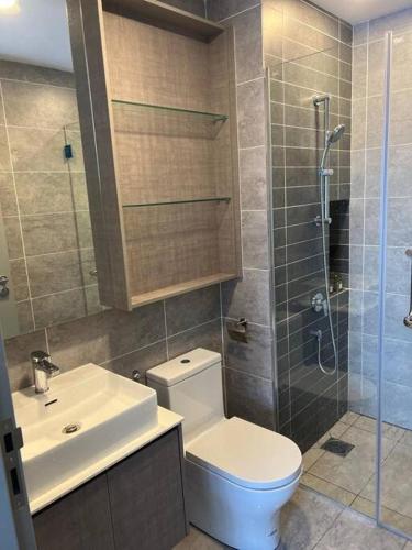 a bathroom with a toilet and a sink and a shower at Millerz Suite 3R2B Condo Near MidValley 3 Beds 3 Bedrooms Staycation Best Choice in Kuala Lumpur