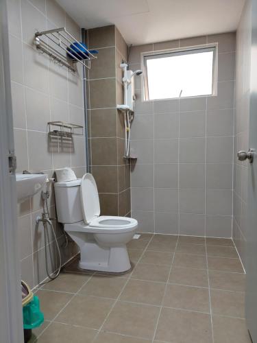 a bathroom with a toilet and a sink at Dlake Putrajaya Homestay in Putrajaya