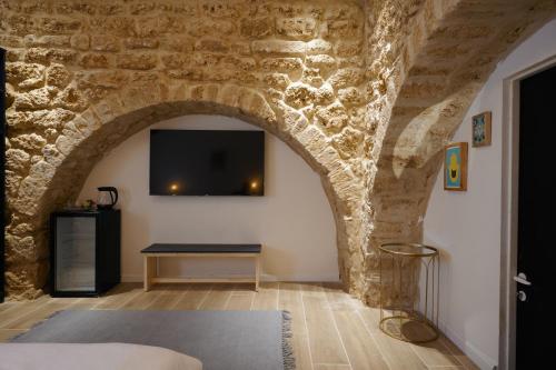 Postel nebo postele na pokoji v ubytování Tel-Aviv LALA Boutique Hotel