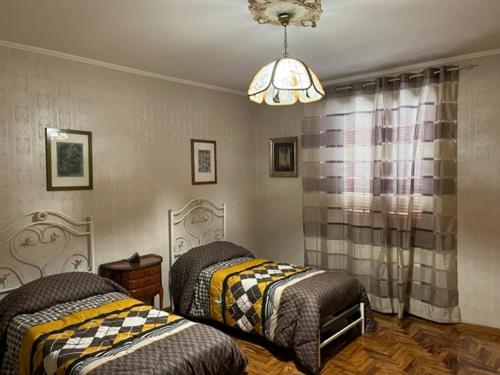 Postel nebo postele na pokoji v ubytování Villa Ines
