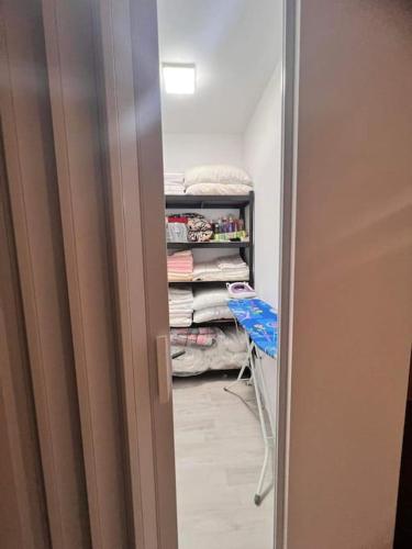 a room with a closet with a rack of clothes at The Tower - Lovely apartment @ Bansko Royal Towers in Bansko