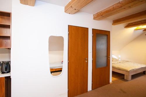 a room with a door and a bed in it at Apartmány NaVyhlídce in Znojmo