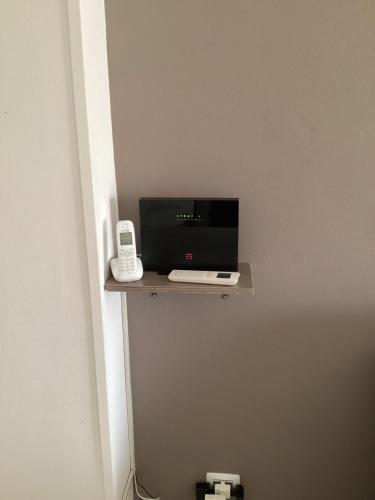 a room with a shelf with a computer on it at Bed and Breakfast da Giuseppe, Camere vicino stabilimento Ferrari in Fiorano Modenese
