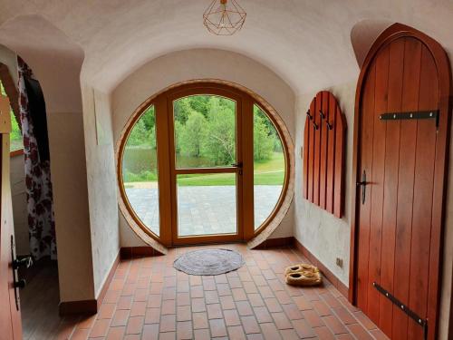 a hallway with two doors and a large window at Wodny Świat in Ostrzyce