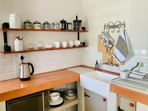 Virtuvė arba virtuvėlė apgyvendinimo įstaigoje Vergeet-My-Niet