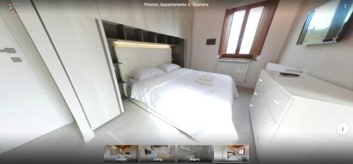 a small bedroom with a white bed and a mirror at Rocca Palazzaccio in Impruneta