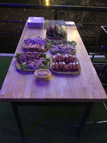 a table with many different types of food on it at Trang An Nature View Homestay in Nguyên Ngoại