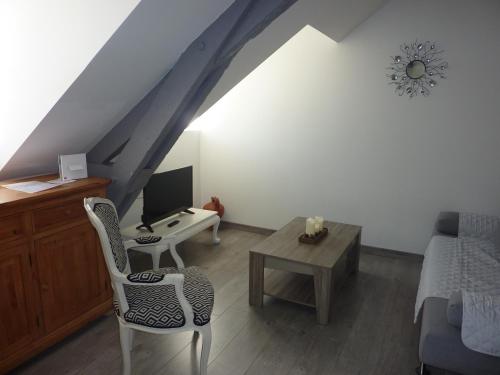 Televízia a/alebo spoločenská miestnosť v ubytovaní Appartement dans Résidence ( parc thermal Argeles Gazost)