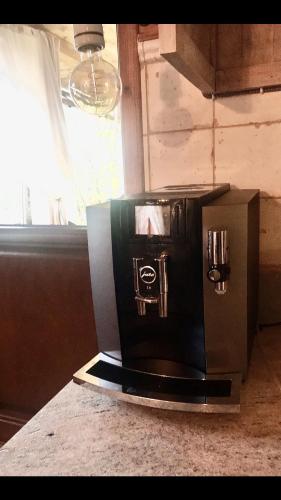 a coffee maker sitting on top of a counter at Zagroda w Puszczy in Białowieża