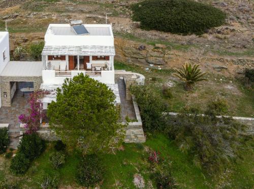 an aerial view of a white house on a hill at Domitilla in Apollonia