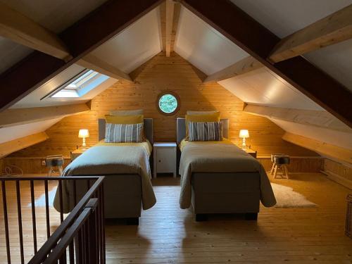 Ένα ή περισσότερα κρεβάτια σε δωμάτιο στο 't Wettenshuys