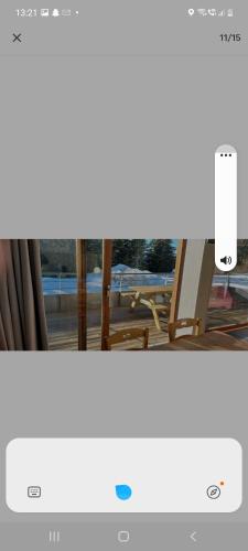 a computer screen with a picture of a window at Appartement 35m2 chamrousse in Chamrousse