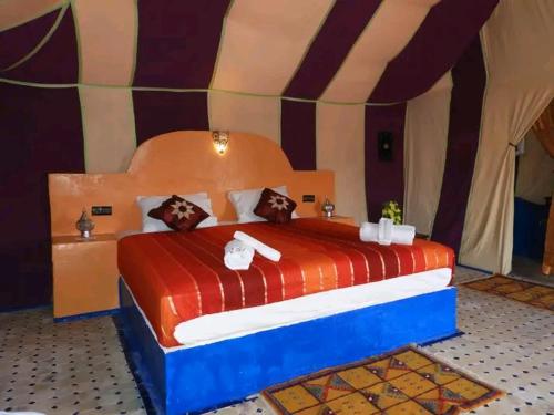 A bed or beds in a room at top luxury desert camp