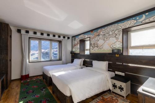 Postel nebo postele na pokoji v ubytování Lo Mustang Himalayan Resort