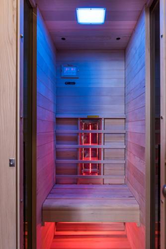 a sauna with a wooden bench in a room at Palazzo di Irene in Chania Town