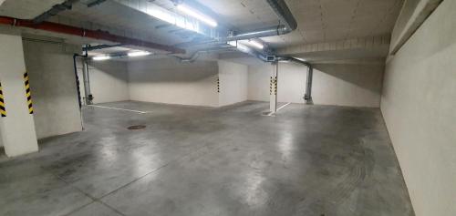 an empty parking garage with a large concrete floor at Willa Matejki in Przemyśl