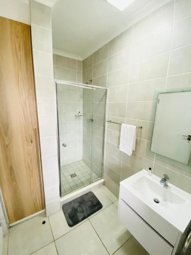 a bathroom with a shower and a sink at Ballito Hills 210 in Ballito
