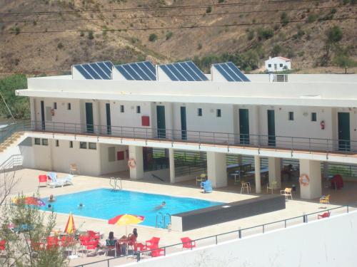 an aerial view of a building with a swimming pool at HI Alcoutim – Pousada de Juventude in Alcoutim