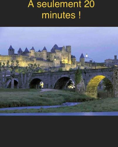 a picture of a castle with a bridge at Maison climatisée avec stationnement et wifi in Bram