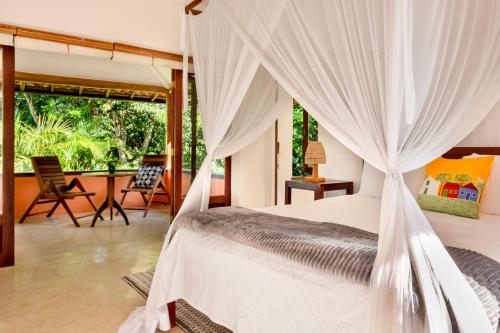 En eller flere senge i et værelse på Casa Laranjeiras, Rio da Barra beach, Trancoso