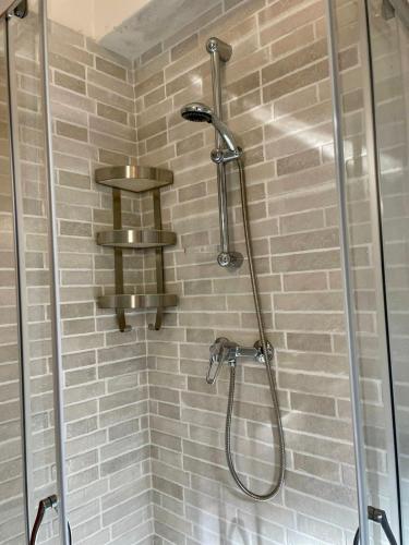 a shower with a shower head in a bathroom at NadSan Mountain House in Camigliatello Silano