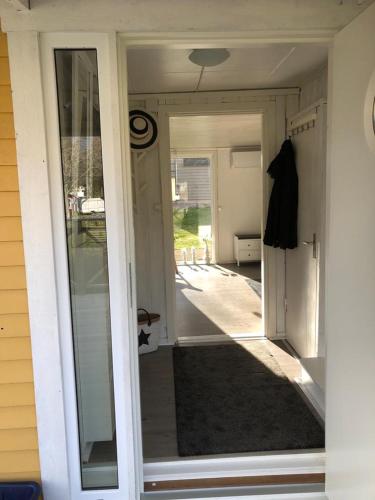 a sliding glass door of a house with a porch at Ferienhaus am Vänern mit Seeblick in Mariestad