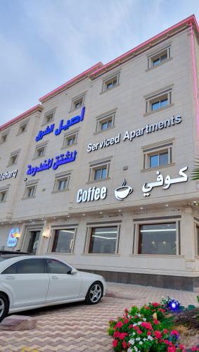 a car parked in front of a building at Aseel Alsharq Serviced Apartments - اقتصادي in Riyadh