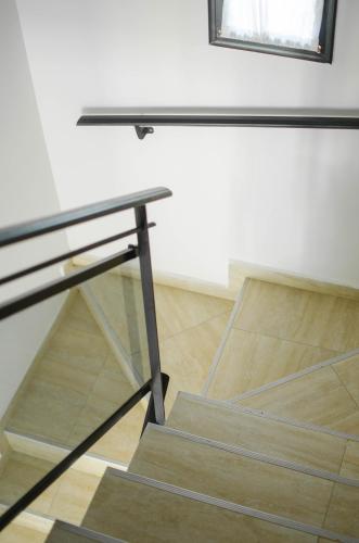 a glass staircase in a room with a window at JAK Colón in Colón