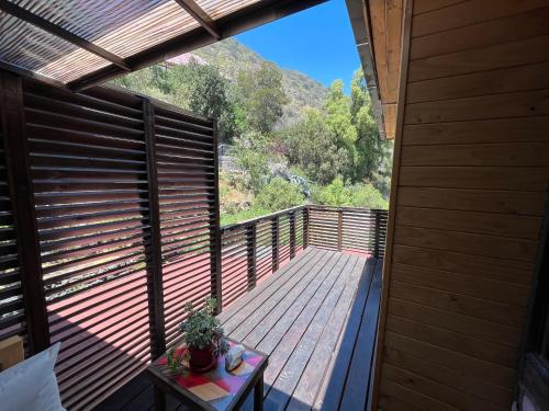 a balcony with a view of a mountain at La Petite France in San José de Maipo