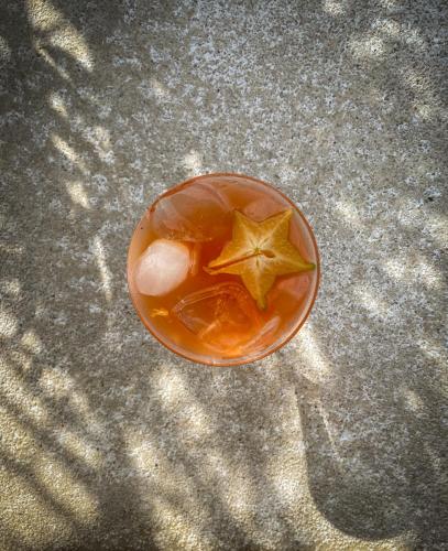 a drink in a glass with a star on the table at Hotel Vista de Olas in Santa Teresa Beach