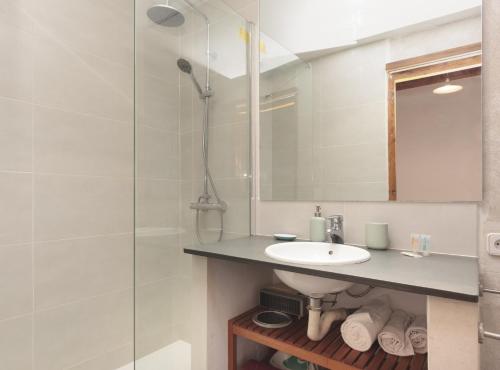 a bathroom with a sink and a shower at Ndlr 2-4 · Authentic flat in Poble Sec - Paralelo in Barcelona