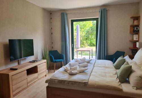 Ένα ή περισσότερα κρεβάτια σε δωμάτιο στο Appartement Uttied mit Terrasse und Garten - 4 Sterne DTV