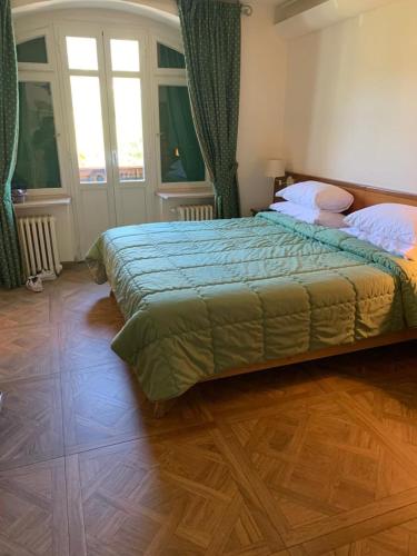 En eller flere senge i et værelse på Hotel Serena Cortina