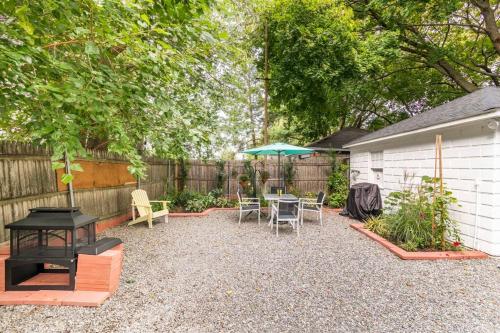 a backyard with a table and chairs and an umbrella at 521 Smith Steet LLC in Providence