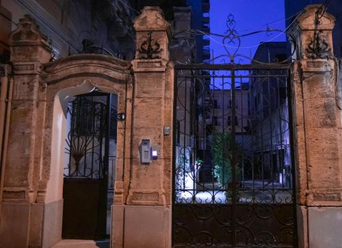 an entrance to a building with a wrought iron gate at Casa 3D'Oro Palermo in Palermo