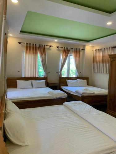 Ein Bett oder Betten in einem Zimmer der Unterkunft Sun & Wind Paradise Bungalow