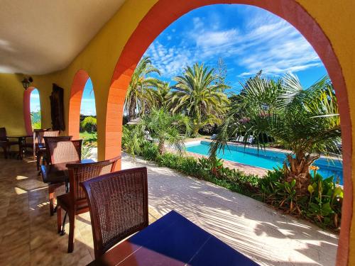 a view of a pool from a resort patio at Villa Paraiso - Naturism Optional Adults Only in Porches