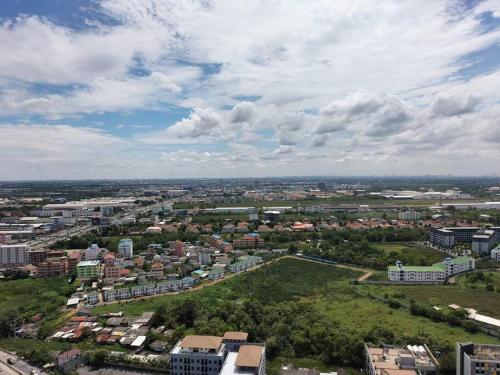 an aerial view of a city with buildings at Two bedroom condo with rooftop pool in Ban Talat Rangsit